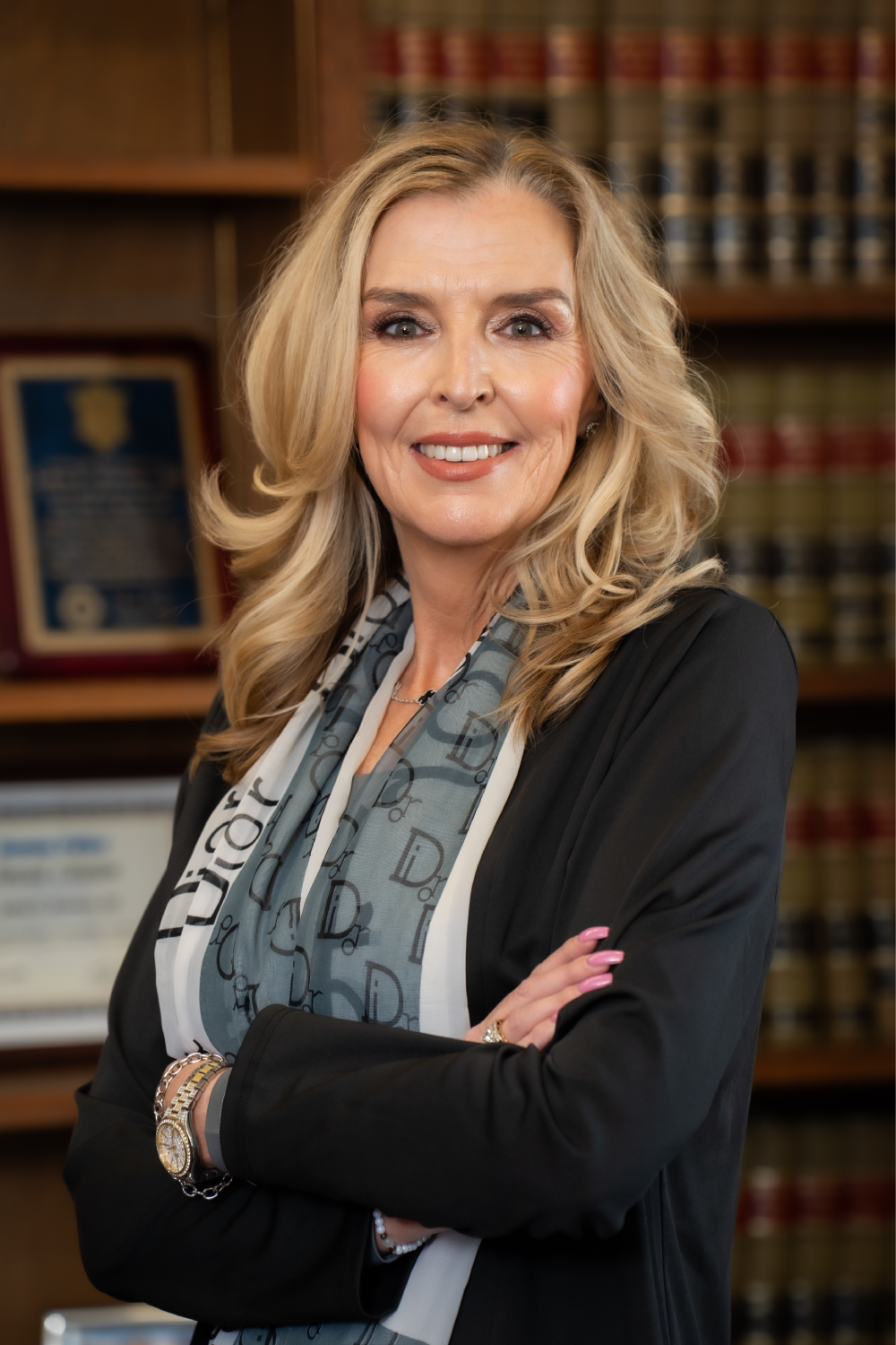 Woman in office setting with bookshelves