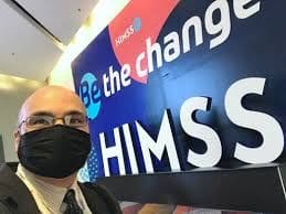 Person wearing mask at HIMSS conference