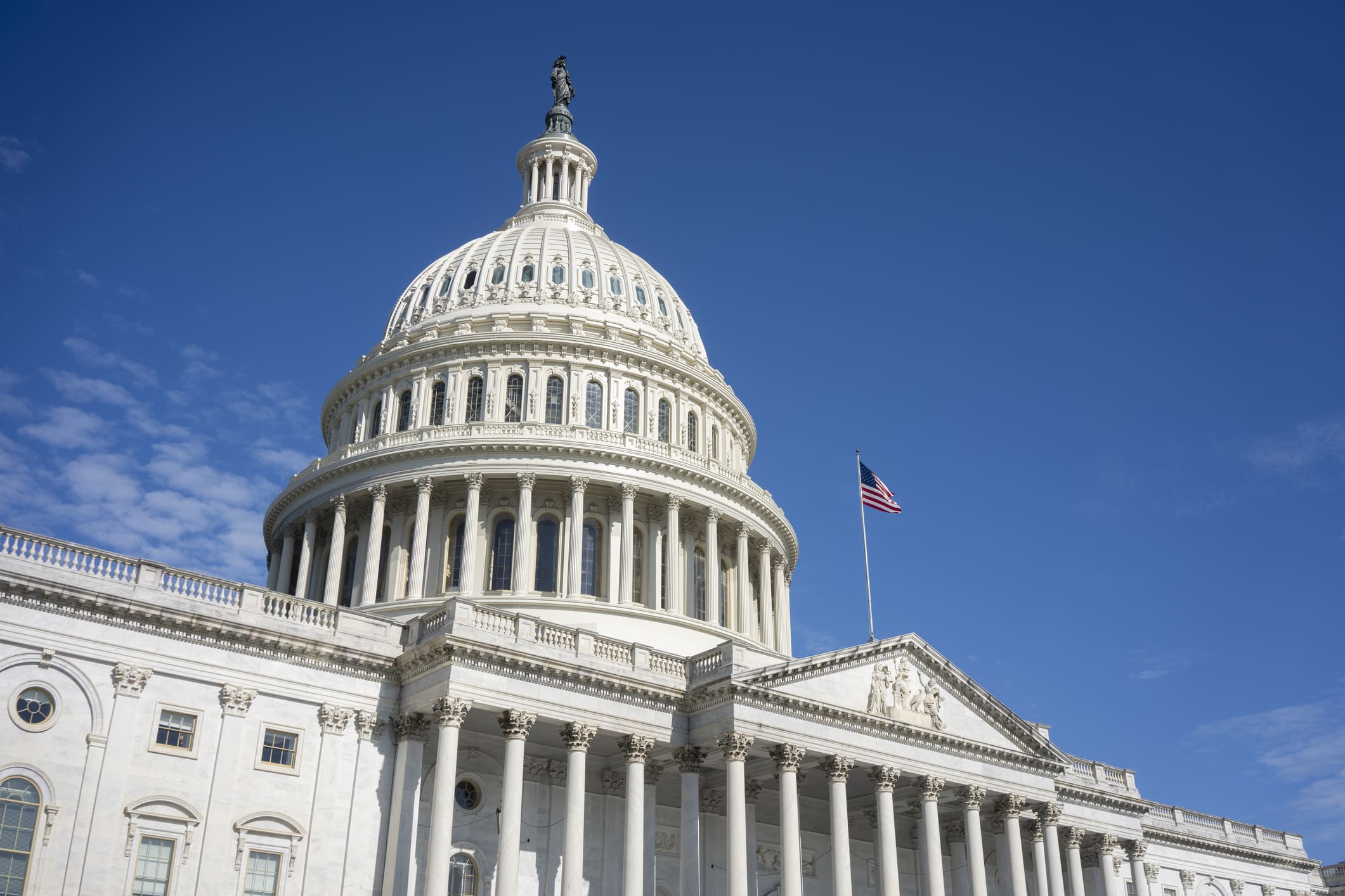 The United States Capitol building with a clear blue sky.
