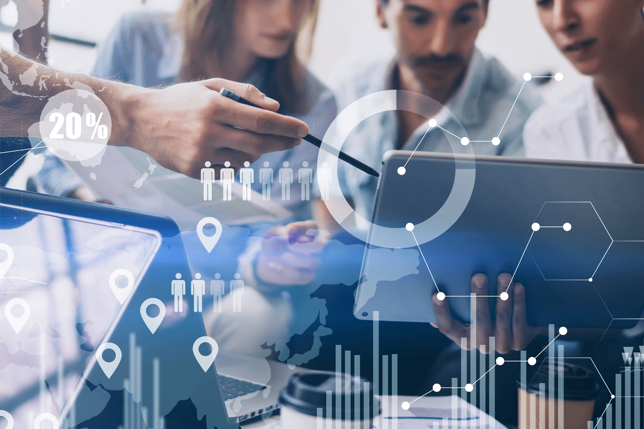 Two professionals analyzing data on a tablet with digital graphs and charts overlay.