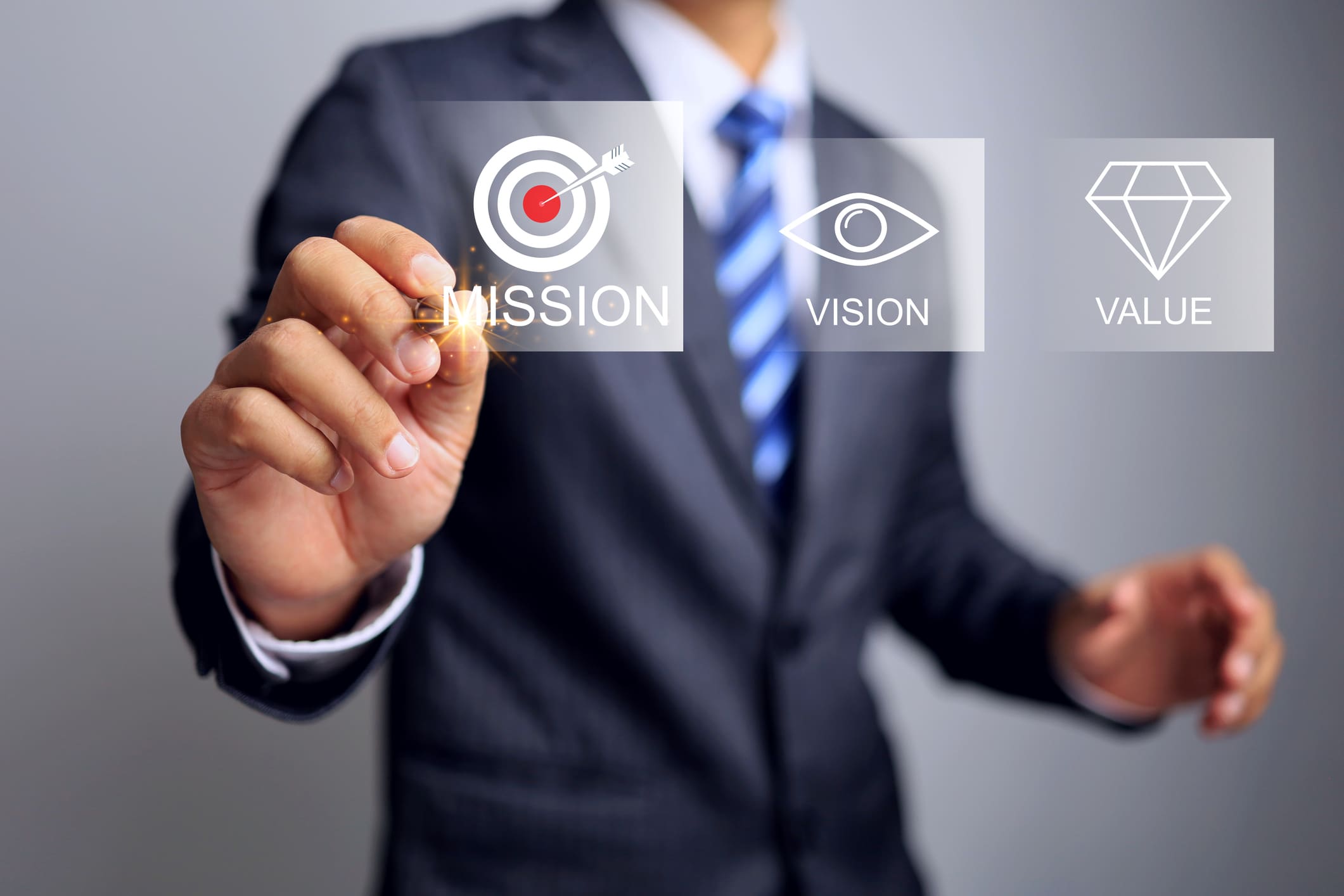 Businessman selecting a mission icon on virtual screen.