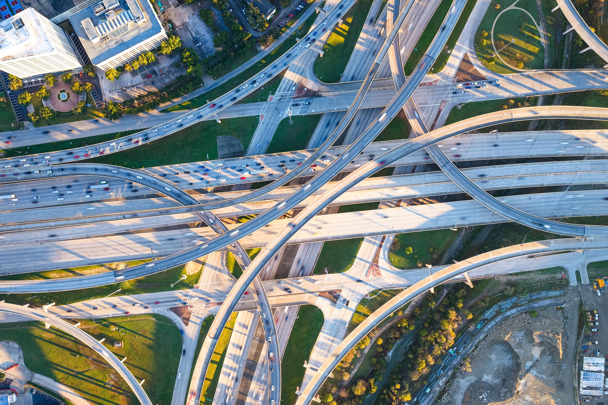 A complex highway interchange with multiple overpasses and vehicles.