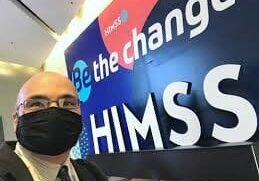 Person wearing mask at HIMSS conference